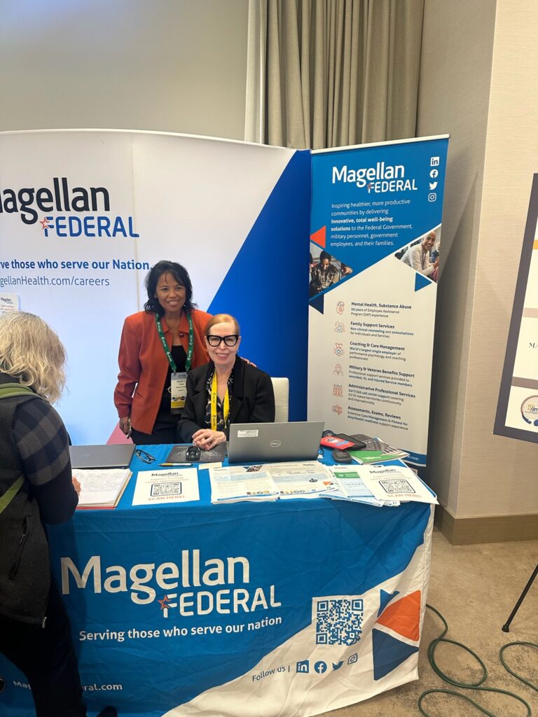 Magellan federal blue and white booth at AFCPE Symposium